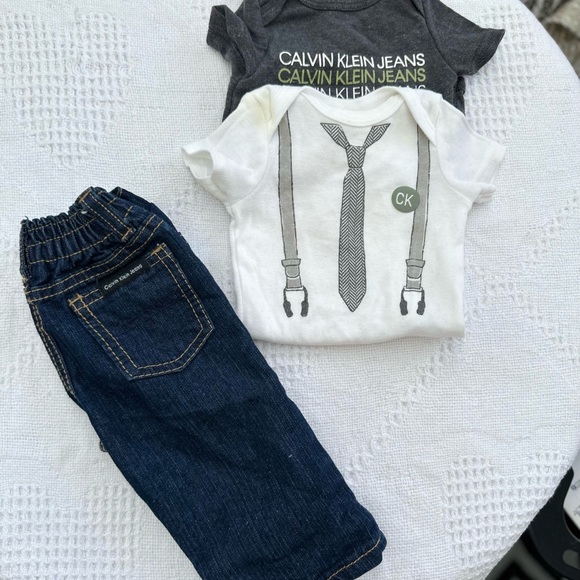 ⭐️2/$20 Calvin Klein | size 0-3m cute diaper onesie and jeans set. - Picture 2 of 4